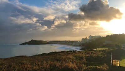 sun rising over beach road and porthmeor beach st ives cornwall